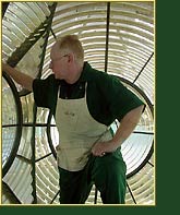 Inspecting the interior of the 1st Order lens at Gibbs Hill, Bermuda, during the restoration process. Click to view enlarged image