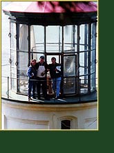 Jim Woodward takes a break for a photograph on the Heceta Head gallery during lens restoration. Click to view enlarged image