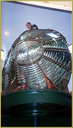Lighthouse Consultant Jim Woodward installs the Rock of Ages Second Order Fresnel lens in the Windigo Ranger Station on Isle Royale. Click to view enlarged image.